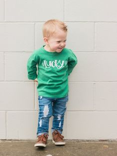 "Adorable St Patrick's Day outfit for baby! Bodysuit features our original \"Lucky\" design (It's hand lettered. Sizing We use super soft cotton/poly blank bodysuits. Newborn: up to 8.5 lbs 0-3m: 8.5 to 11.5 lbs 3-6m: 11.5 - 15.5 lbs 6-12m: 15.5 - 20 lbs 12-18m: 20-25 lbs Tshirts available in 2y, 4y, 6y for long sleeve, 2T-5T for short sleeve. Timing Bodysuits/tees can ship quickly." Lucky Design, Fete Saint Patrick, Pancakes And Pajamas, St. Patrick’s Day, Pajama Outfit, Baby Boy Shirts, St Patrick's Day Outfit, St Patricks Day Shirt, St. Patricks Day