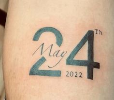 a close up of a person's leg with a tattoo on it that says may 4