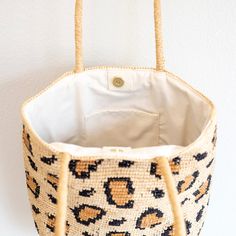 IN STOCK FAST SHIPPING FROM LOS ANGELES Unleash your wild side with the Elena Handbags Leopard Design Raffia Summer Tote Bag! Made from durable straw raffia, this summertime essential features a trendy leopard print that will add a touch of fun to any outfit. Perfect for carrying all your essentials, this bag is a must-have for the summer season. Natural Soft Raffia Straw Handmade Inside pocket Fully lined Size: 12"H x 14.5"W x 5.5"D Strap drop length: 10.5" Designer Style ID: 8690 Eco-friendly Bags With Bamboo Handle For Vacation, Beach Season Bags With Bamboo Handle, Beach Season Bags With Bamboo Handle And Natural Fiber, Vacation Bucket Bag In Natural Fiber, Vacation Bucket Bag Made Of Natural Fibers, Natural Fiber Bags With Bamboo Handle For Beach Season, Summer Style Natural Fiber Bucket Bag, Beach Bags With Natural Fiber Handles, Vacation Straw Bucket Bag With Handles