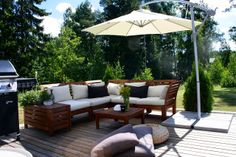 an outdoor living area with patio furniture and grill