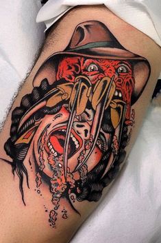 a man's leg with an artistic tattoo on it