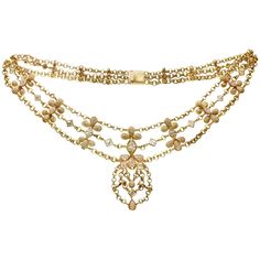 This exquisite Chatila necklace is crafted in 18k yellow gold and is composed of three rolo chains, pear-shaped elements pave-set with E-F VVS1-VVS2 diamonds and accented with square and marquise-cut diamonds bezel-set in 18k yellow gold. The center marquise-cut diamond weighs an estimated 0.75 carats, the fancy-cut diamonds weigh between 0.20 to 0.40 carats each, and 312 round brilliant-cut diamonds weigh an estimated 4.50 carat. In total, there is about 330 diamonds weighting an estimated of 9 Luxury Ethereal Yellow Gold Jewelry, Luxury Gold Diamond Necklace With Pave Setting, Luxury Yellow Gold Diamond-shaped Necklace, Luxury Round Yellow Gold Bridal Necklace, Luxury Exquisite Yellow Gold Diamond Necklace, Luxury Vintage Box Chain Necklace, Luxury Antique Gold Chain Necklace, Evening Necklace, Haute Jewelry