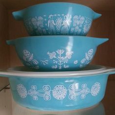 three blue bowls stacked on top of each other