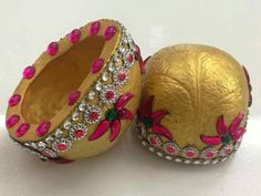 two decorated eggs sitting next to each other