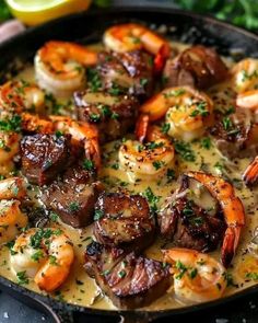 a skillet filled with shrimp and sausage