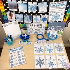 a table topped with snowflakes and cards