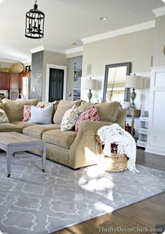 a living room filled with furniture and a chandelier