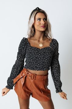 Slay all day in our cute black 'Just A Call Away' crop top featuring lightweight material patterned with white polka dots, a flattering bodice with a flirty neckline, long loose sleeves with ruffled cuffs, a square upper back, and a figure hugging silhouette that ends in a straight cropped hemline   Measurements S variant has  a Bust of 30",  a Length of 16",  a Sleeve Length of 24",  a Waist of 28".  M variant has  a Bust of 32",  a Length of 16.5",  a Sleeve Length of 24.5",  a Waist of 30". Long Sleeve Ruffled Crop Top For Day Out, Flirty Black Cropped Top, Flirty Black Crop Top, Long Sleeve Polka Dot Top For Night Out, Polka Dot Long Sleeve Top For Night Out, Flirty Long Sleeve Crop Top, Trendy Polka Dot Top For Night Out, Plaid Jacket, Off Shoulder Tops