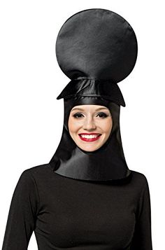 a woman wearing a black hat with a large round object on it's head