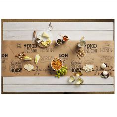 a table topped with lots of different types of food on top of a paper bag