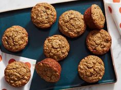 freshly baked muffins on a blue platter