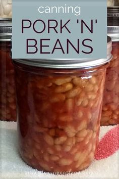 jars filled with beans sitting on top of a table