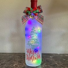 a bottle with a christmas tree on it