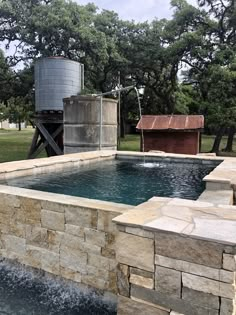 an outdoor hot tub with water coming out of it