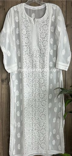 Georgette kurti has fine hand embroidery with Mukaish Kaamdani add ons. Liner included  Kurta Length-47 inches White Chikankari Embroidered Kurta For Puja, White Kurta, To My Daughter, Womens Clothing Tops, Hand Embroidery, Bathing Beauties, Tops & Tees, Display Homes, White