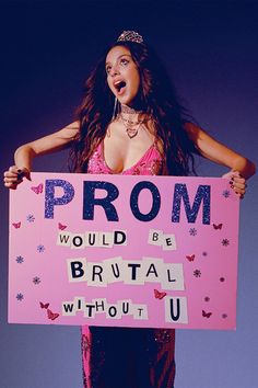 a woman holding a sign that says prom would be bridal without u