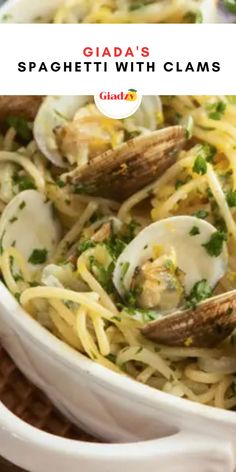 spaghetti with clams and parsley in a white bowl