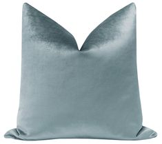 a light green pillow with a satin finish on the front and back of it,