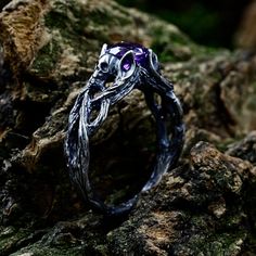 a close up of a ring on some rocks