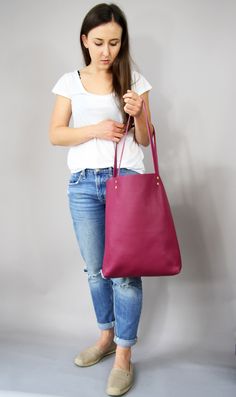 "Leather tote bag, Leather tote, Tote bag leather, Tote bag, Leather tote woman, Leather tote - MADRID SIMPLE LEATHER TOTE BAG Dimensions: Height: 15.5'' 39 cm Width: 12.2'' 31 cm Handles: 23.6'' 60 cm Handle drop: 10.2\" 26 cm Casual and simple tote bag made from high quality pebbled leather. It is slim, lightweight, strong and fits comfortably over the shoulder. * Highest quality Italian leather * Includes interior zipped pocket and key chain * Gold zipper & hardware * Fits a laptop (up to Pink Soft Leather Tote Bag, Large Pink Everyday Bag, Pink Tote Bucket Bag For Everyday, Everyday Pink Soft Leather Satchel, Large Bags For Errands, Simple Tote Bag, Simple Tote, Magenta Purple, Simple Leather