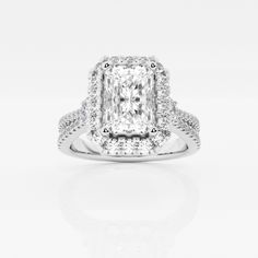 an engagement ring with a cushion cut diamond in the center