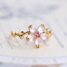 18K Solid Gold Rose Quartz Crystal Flower Ring, Japanese Peach Blossoms Floral Ring, Pink Rose Quartz Crystal Ring, Flower Shaped Ring DETAILS ♡⃛ ⃛ Main stone: Rose Quartz Side stone: Pink Tourmaline, Moissanite Band width: 1.5mm Band thickness: 1.2mm OUR GEMSTONES ♡⃛ ⃛ At Kiseki Kiara, we use both precious and semi-precious stones throughout our jewelry designs, with each stone set-by-hand in our workshop. We carefully source gemstones for their quality and color ensuring you receive the best q Japanese Peach, Cute Engagement Rings, Rose Gold Quartz, Floral Ring, Rose Quartz Ring, Peach Blossoms, Jewelry Lookbook, Fancy Jewelry, Cute Rings