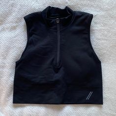 10/10 Condition, Never Worn Just Tried On. Fyi The Material Is Pretty Stiff. Versatile Black Stretch Crop Top, Versatile High Stretch Black Crop Top, Versatile Black Sleeveless Crop Top, Versatile Fitted Black Crop Top, Versatile Sleeveless Black Crop Top, Black Sleeveless Crop Top For Athleisure, Black Sleeveless Athleisure Crop Top, Functional Black Crop Top For Workout, Functional Black Workout Crop Top