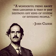 a man wearing a suit and tie in front of a quote from john cleese