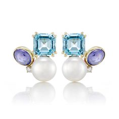 Since 1861, Gump's has been a destination for jewelry that is distinctive, extraordinary and timeless. Featuring only the finest materials, each piece is a statement of elegance. Freshwater cultured pearls. Diamonds, 0.10ctw. Blue topaz. Tanzanite. 14-karat yellow gold. Pierced or clip. 7/8" diameter. Luxury Multi-stone Earrings For Formal Occasions, Elegant Multi-stone Diamond Earrings, Formal Multi-stone Fine Jewelry Earrings, Multi-stone White Gold Earrings For Formal Occasions, Luxury Briolette Pearl Earrings, Luxury Multi-stone Earrings For Anniversary, Elegant Multi-stone Round Earrings, Luxury Blue Pearl Earrings For Anniversary, Elegant Yellow Gold Multi-stone Earrings