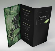 an open brochure with green leaves on the front and back cover is shown