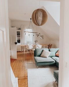 a living room filled with furniture and a white rug