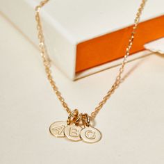 An imprint on your heart and on your jewelry, our Personalized Letter Pendant Necklace is the perfect way to treasure the love of your little ones. Choose up to 5 letter pendants to represent your children's initials, hand-engraved with their names or date of birth on the reverse.18K Champagne Gold Plated or 925 Sterling SilverLetter charm: 0.3Secure clasp fasteningCharms are removable from this chain and can be worn on all Merci Maman chain lengthsHand-engraved in our Paris WorkshopSent with lo Personalized Dainty Initial Pendant Charms, Dainty Personalized Initial Pendant Charms, Initial Pendant Charms For Personalized Gift, Personalized 14k Gold Initial Necklace For Mother's Day, Personalized Initial Pendant Charm Necklace For Anniversary, Personalized Initial Pendant Charms, Dainty Personalized Charms For Anniversary, Initial Pendant Charm Necklaces As Anniversary Gift, Name Initial Pendant Charm Necklace For Anniversary