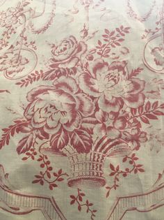 a table cloth with red flowers on it