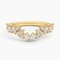 a yellow gold ring with five pear shaped diamonds