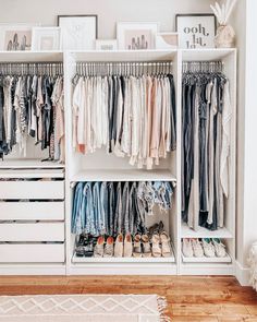 a white closet filled with lots of clothes