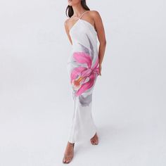 Let the Liliana Floral Maxi Dress take you on a romantic summer adventure. With a cross halterneck and backless design, this dress is perfect for beach days or resort getaways. The large floral print adds a touch of whimsy to this elegant piece. From Good Girl Things Summer in Bloom Collection. Details Eliza Floral Maxi Dress in White Cross halterneck Backless Large floral printed long dresss Romantic summer dress, resort dress Good Girl Things Summer in Bloom Collection Ruffle Skirts, Resort Dress, Holiday Boutique, Beauty Features, Romantic Summer, Large Floral Print, Resort Vacation, White Cross, Resort Dresses