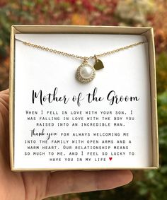 the mother of the groom necklace is shown in a box with its message on it