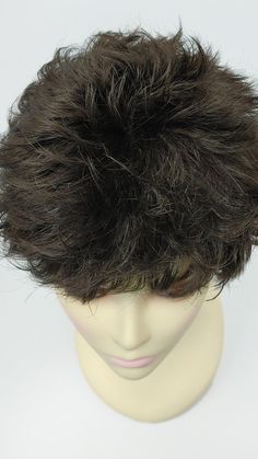 "Short and layered boy cut flip style wig. Inside cap has adjustable elastic straps for a secure fit. Color: Dark Brown (4) Style: Short flip style Circumference: Default at 21\" with adjustable cap (max 22\") Materials: Synthetic Wig Fiber All sales are final. Please read all store policies before purchasing." Boy Cut, Back Combing, Style Wig, Boy Cuts, Stocking Cap, Synthetic Wig, Short Pixie, Synthetic Wigs, Halle