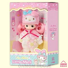 a little doll in a pink box with hello kitty on it's head and ears