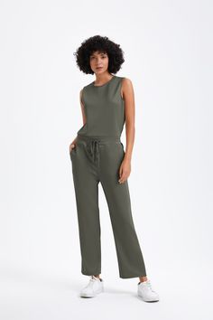 "When I tell you this set feels light as air, I'm not kidding. The perfectly loose-and-lightweight fabric is like buttah!”-Oprah One of Oprah's Favorite Loungewear Stay sophisticated for any special outing while wearing this Air Essentials Jumpsuit. Heighten the look of this wardrobe cornerstone with simple jewelry and sky-high heels to turn heads everywhere you go. Details Light-as-air fabric offers maximum softness 4-way stretch for easy movement with side pockets Button closure design of the Wide Leg Loungewear Jumpsuit, Sleeveless Relaxed Fit Solid Color Jumpsuits And Rompers, Solid Color Wide Leg Jumpsuits And Rompers For Loungewear, Solid Color Wide Leg Jumpsuits For Loungewear, Wide-leg Jumpsuits For Loungewear, Wide Leg Solid Color Jumpsuits And Rompers For Loungewear, Relaxed Fit Sleeveless Jumpsuits For Loungewear, Solid Color Sleeveless Relaxed Fit Jumpsuit, Closure Design