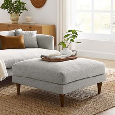 a living room scene with focus on the ottoman