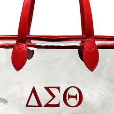 Comply with those events on campus or arenas that require clear accessories. Clear Tote Material with Red Accents DST Printed Greek Letters in Red Top Zip Opening, 10" Strap Drop Bag Size: 12" L, 12" H, 5" Red Rectangular Bag With Clear Strap, Red Bags With Clear Strap For Everyday Use, Clear Tote Bags, Greek Letters, Red Top, Green Tops, Red Accents, Tote Bag