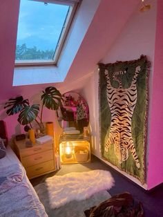 a bedroom with pink walls and an animal print on the wall