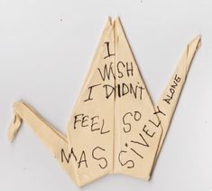 an origami bird with writing on it that says i wish i didn't feel so massive