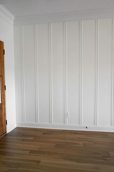 an empty room with white walls and wood flooring is pictured in this image from the doorway