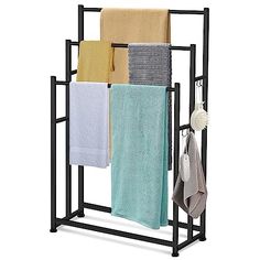 a towel rack with four towels hanging from it's sides and two folded ones on the other side