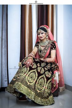 a woman in a bridal dress sitting on the floor