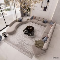 a living room filled with lots of furniture and decor on top of a white rug