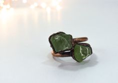 "Green Peridot ring | Raw peridot ring | Copper & peridot ring | Electroformed jewelry | Organic stone jewelry This listing is for one raw peridot crystal electroformed to a hand-hammered 12 gauge recycled copper ring. If your size is unavailable, please select \"custom\" from the drop down menu and indicate the size you need at check out. Our jewelry is unique and one-of-a-kind. Please note there will likely be variances in the size, shape and color of each stone. All elements of your piece Green Peridot Open Ring Jewelry, Handmade Peridot Ring For May Birthstone, Green Peridot Rings With Nature-inspired Style, Nature-inspired Peridot Rings As Gift, Unique Green Peridot Rings, Raw Peridot, Peridot Crystal, Tiny Studio, Electroformed Jewelry