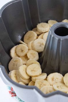 a pan filled with sliced bananas on top of a table